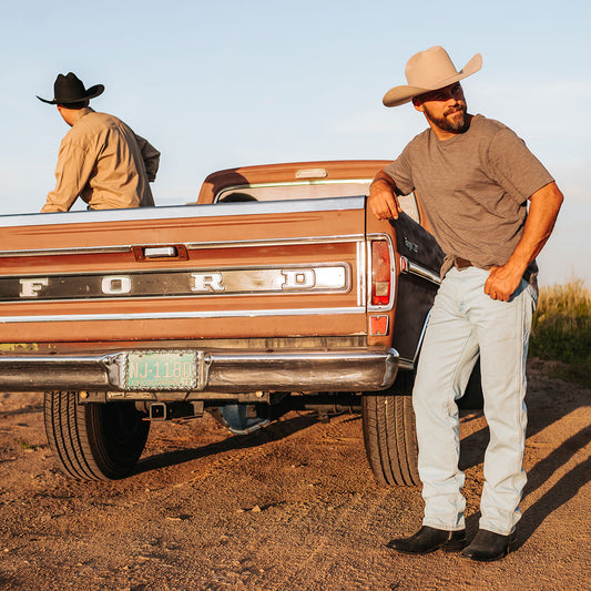 FREEBIRD men's Tifton black single exterior pull strap, squared toe, and inside zip closure low heeled mid calf boot lifestyle image