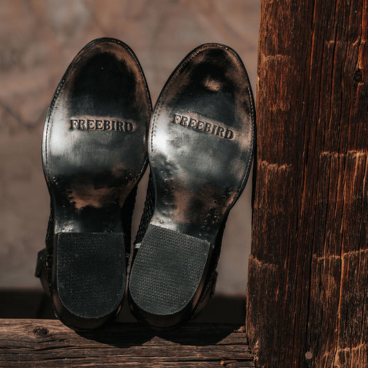 FREEBIRD men's Union black ostrich leather boot with leather pull straps, traditional stitching and square toe construction