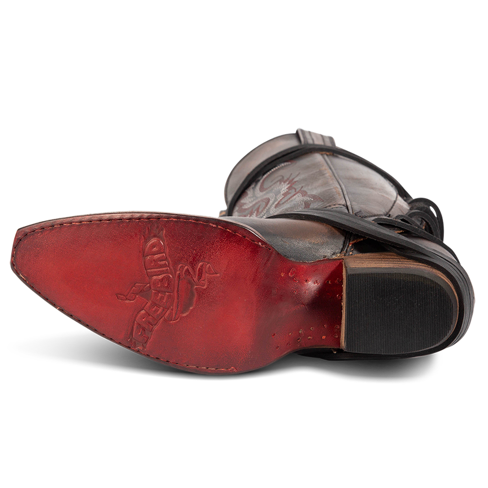 Leather sole imprinted with FREEBIRD on women's Wardon black leather cowboy boot with back lace panel