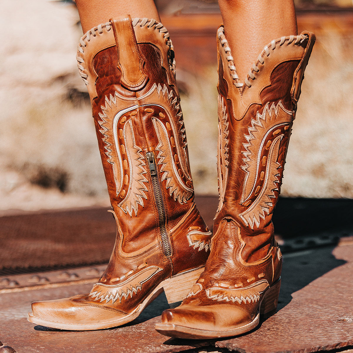 FREEBIRD women's Wayne cognac multi leather western mid-calf boot with whip-stitch and laser cut detailing, a snip toe and inside working brass zipper