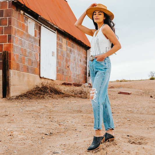 FREEBIRD women's Wentworth black western mule featuring elastic gore, stitch detailing, open back, and snip toe