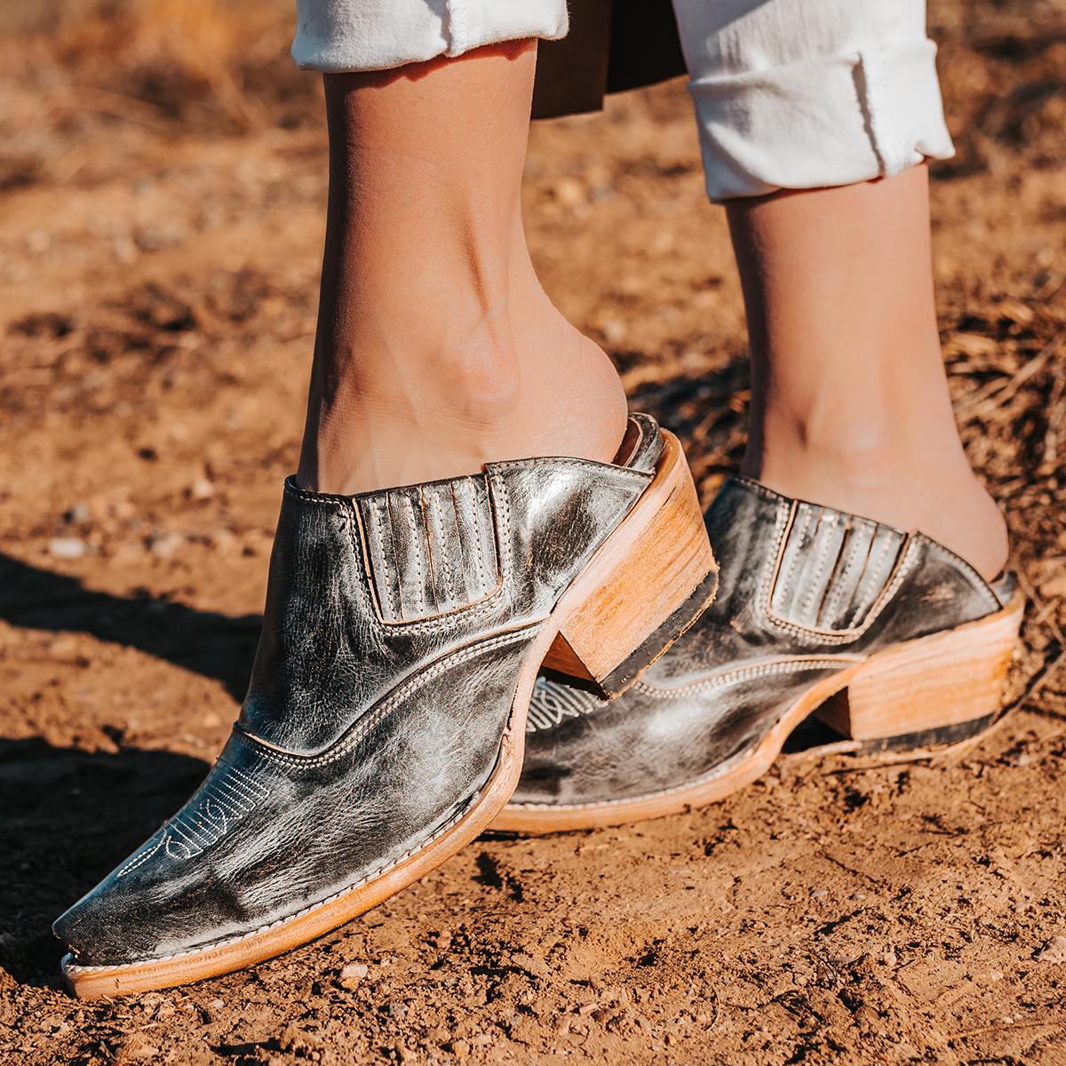 FREEBIRD women's Wentworth ice western mule featuring elastic gore, stitch detailing, open back, and snip toe