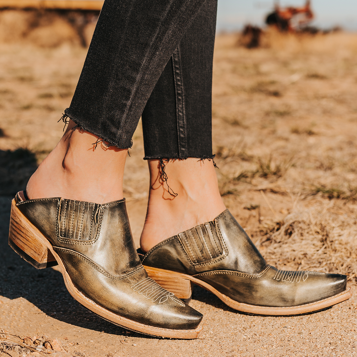 FREEBIRD women's Wentworth olive western mule featuring elastic gore, stitch detailing, open back, and snip toe