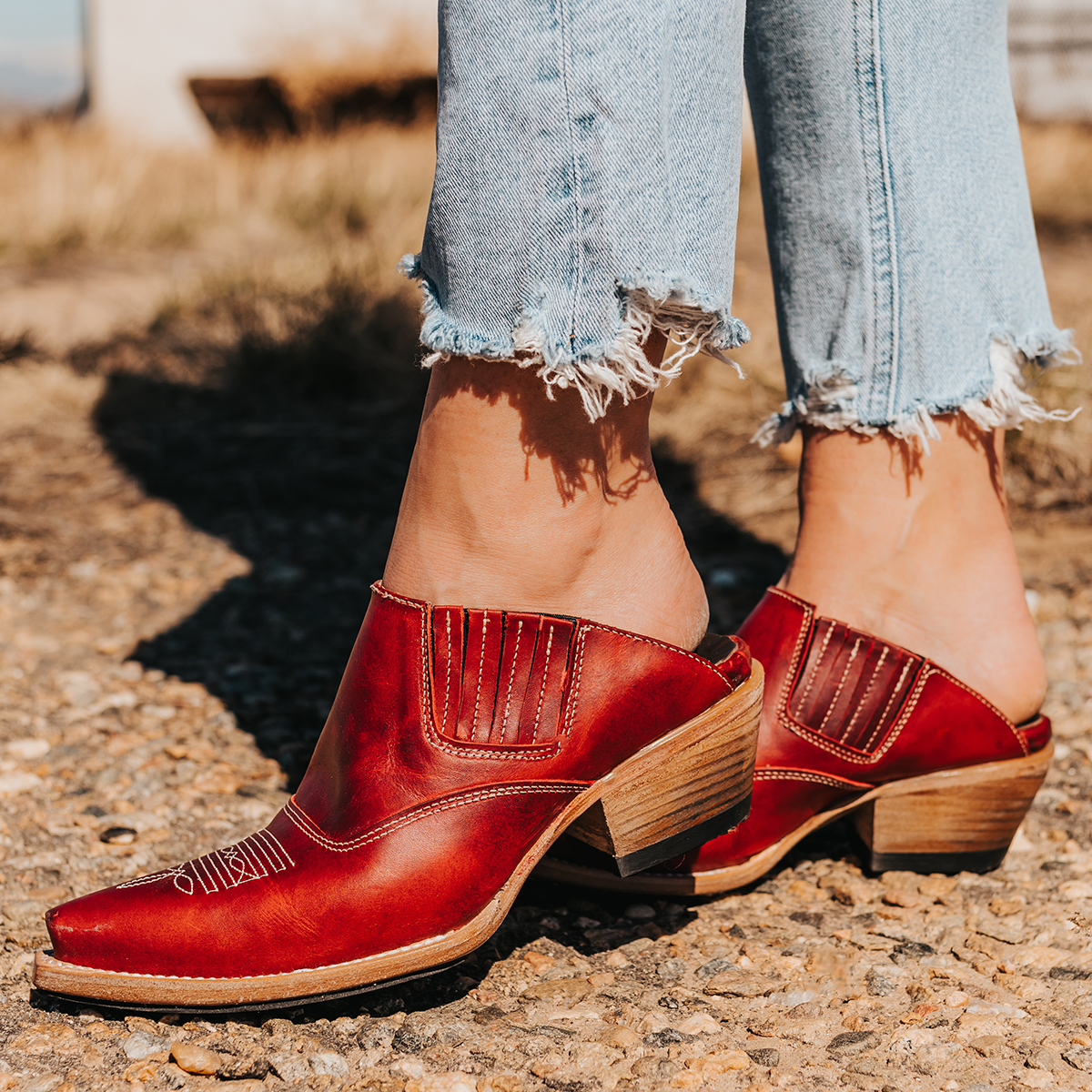 FREEBIRD women's Wentworth red western mule featuring elastic gore, stitch detailing, open back, and snip toe