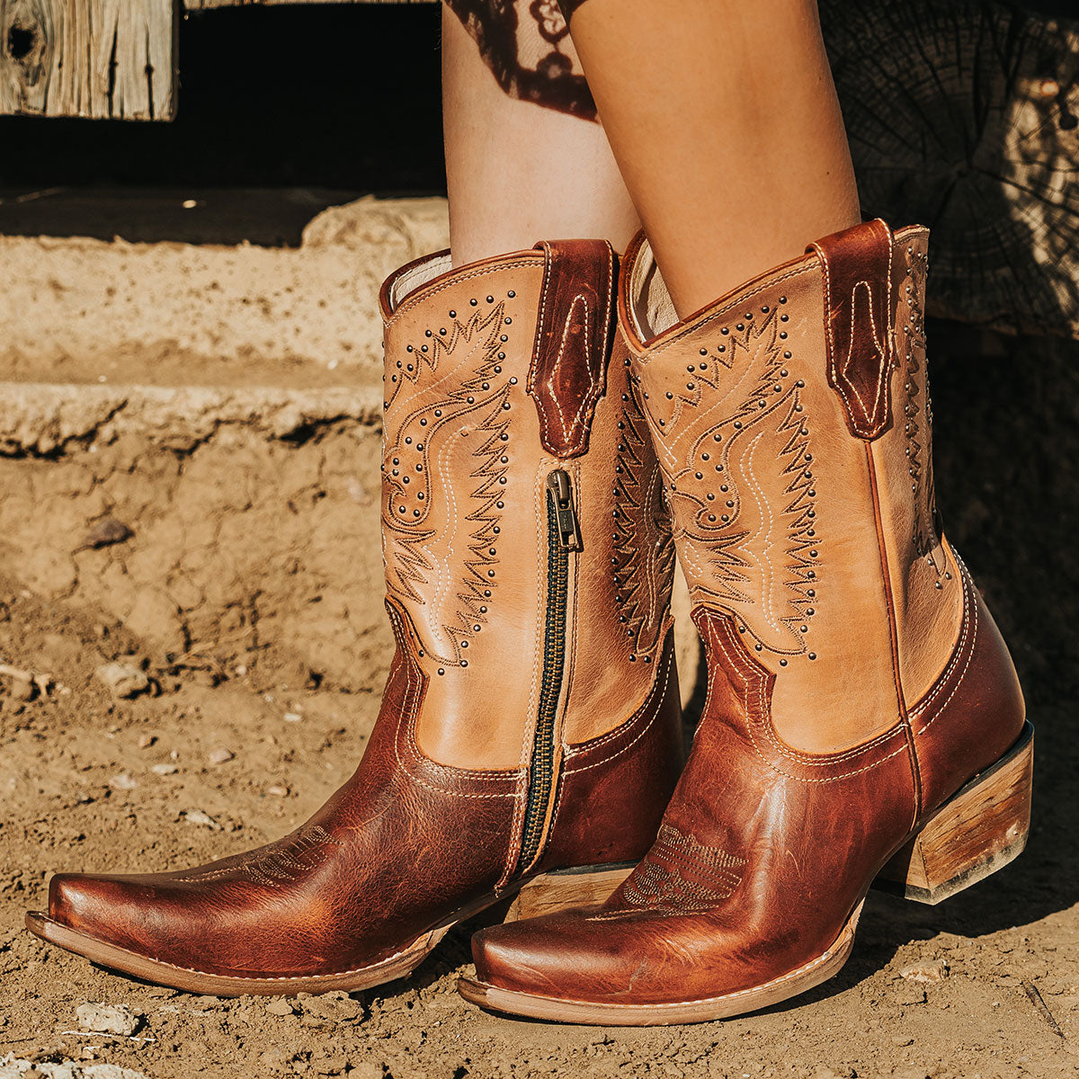 FREEBIRD women's Westrose tan embroidered mid-calf boot with stud detailing, leather pull tabs, and stacked heel