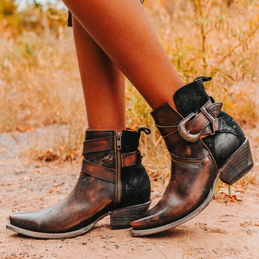 FREEBIRD women's Whip black leather ankle bootie with western buckle and pointed snip toe