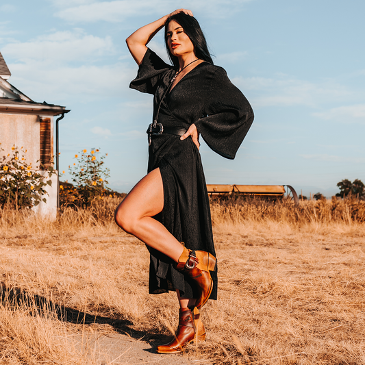 FREEBIRD women's Whip cognac leather ankle bootie with western buckle and pointed snip toe lifestyle