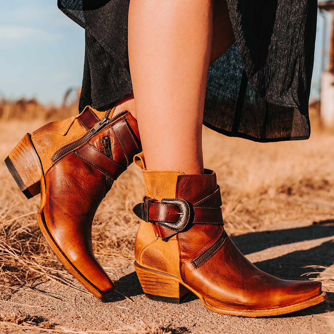 FREEBIRD women's Whip cognac leather ankle bootie with western buckle and pointed snip toe