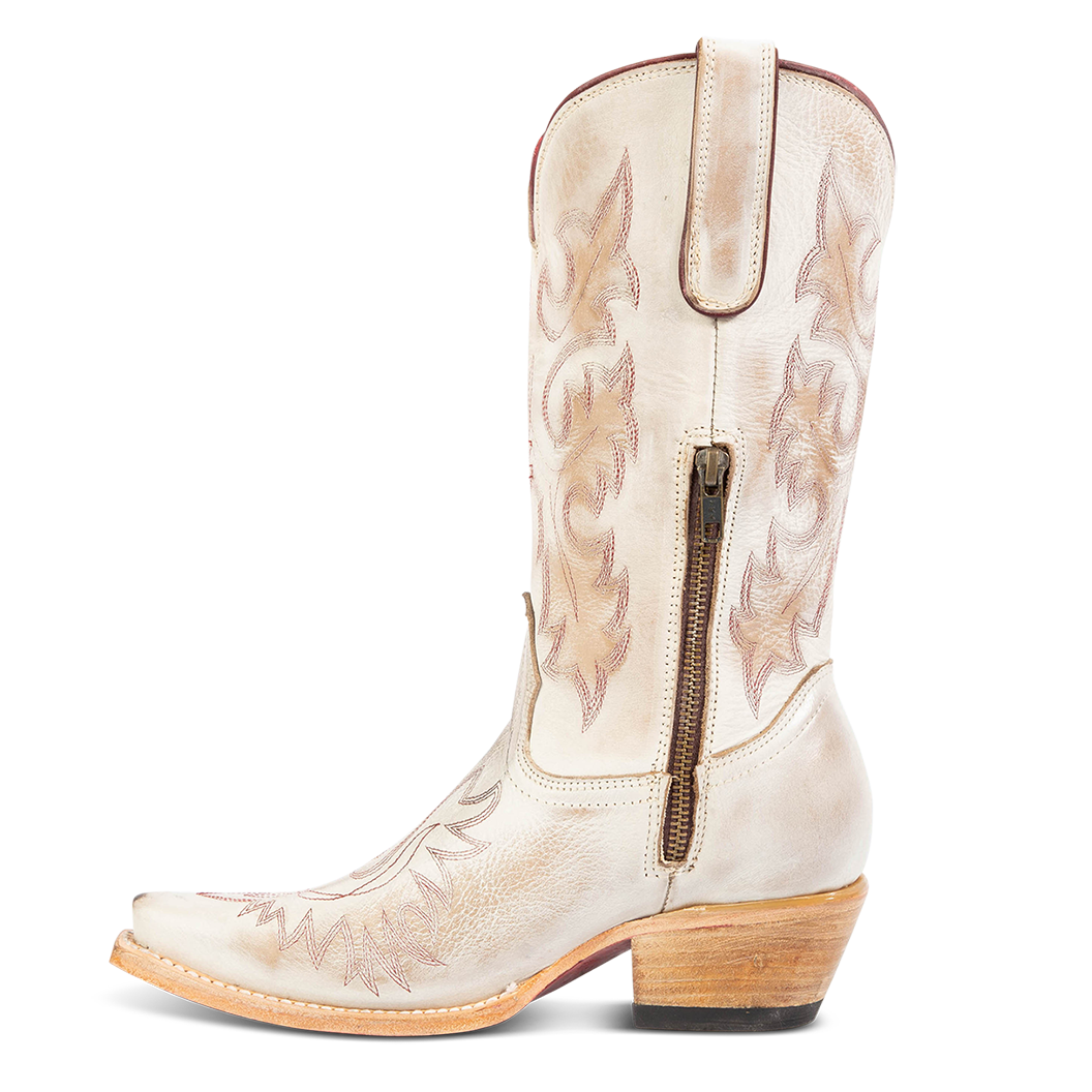 Side view showing snip toe construction, intricate shaft and toe stitching, and half zip closure on FREEBIRD women's Wilson beige leather western boot
