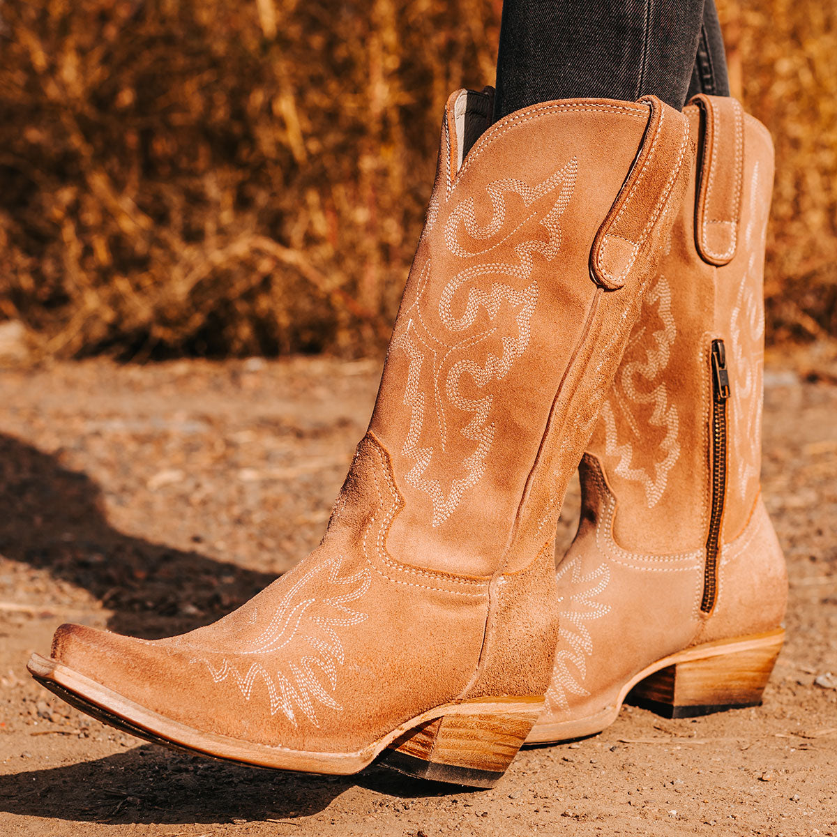 FREEBIRD women's Wilson blush suede western boot with snip toe construction, intricate shaft and toe stitching, and half zip closure