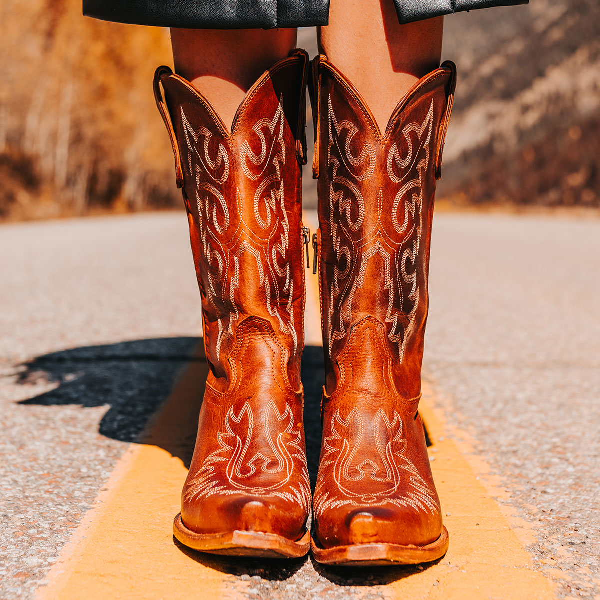 FREEBIRD women's Wilson Cognac leather western boot with snip toe construction, intricate shaft and toe stitching, and half zip closure