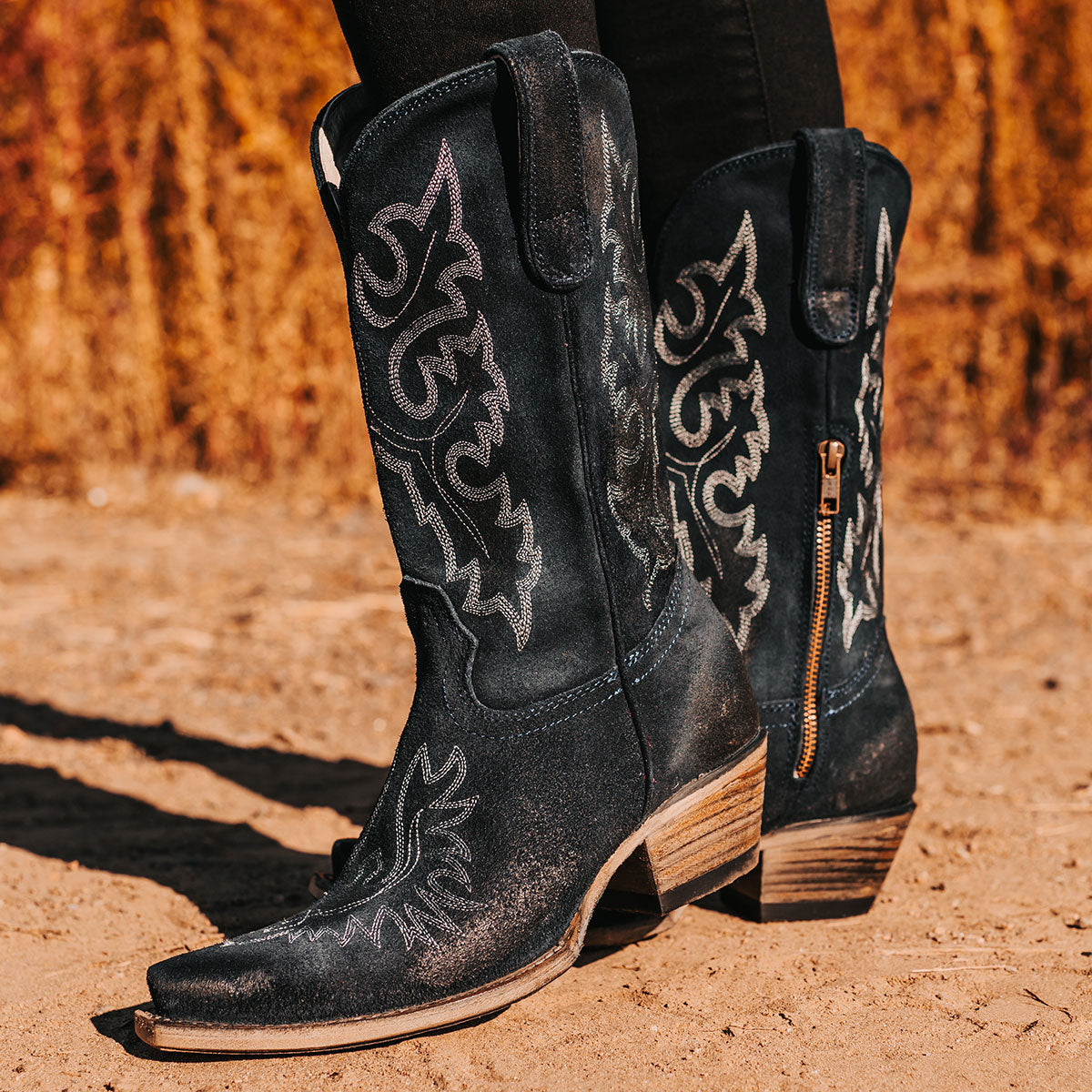 FREEBIRD women's Wilson navy suede western boot with snip toe construction, intricate shaft and toe stitching, and half zip closure
