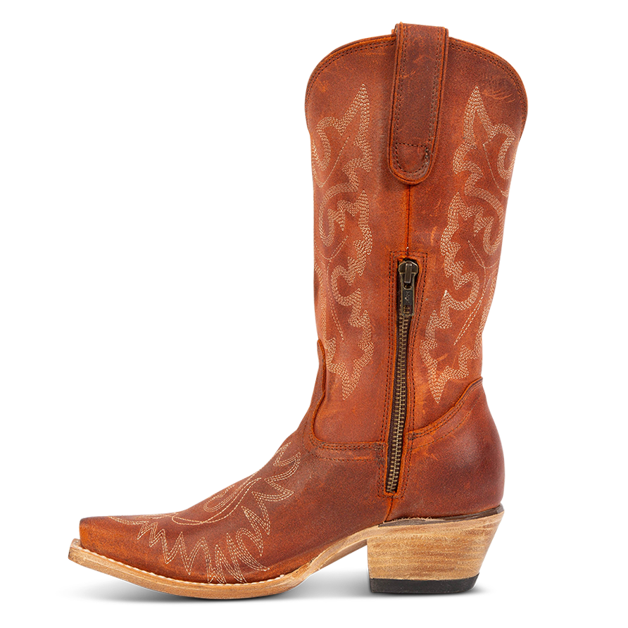Side view showing snip toe construction, intricate shaft and toe stitching, and half zip closure on FREEBIRD women's Wilson rust suede western boot