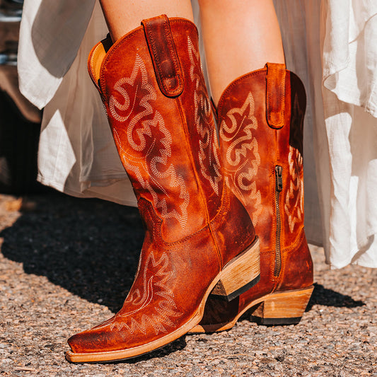 FREEBIRD women's Wilson rust suede western boot with snip toe construction, intricate shaft and toe stitching, and half zip closure