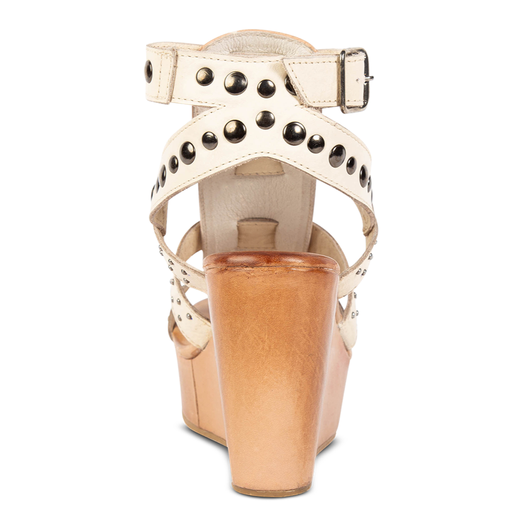 Back view showing adjustable ankle strap on FREEBIRD women's Winter beige multi wedge heel platform sandal featuring stud detailing