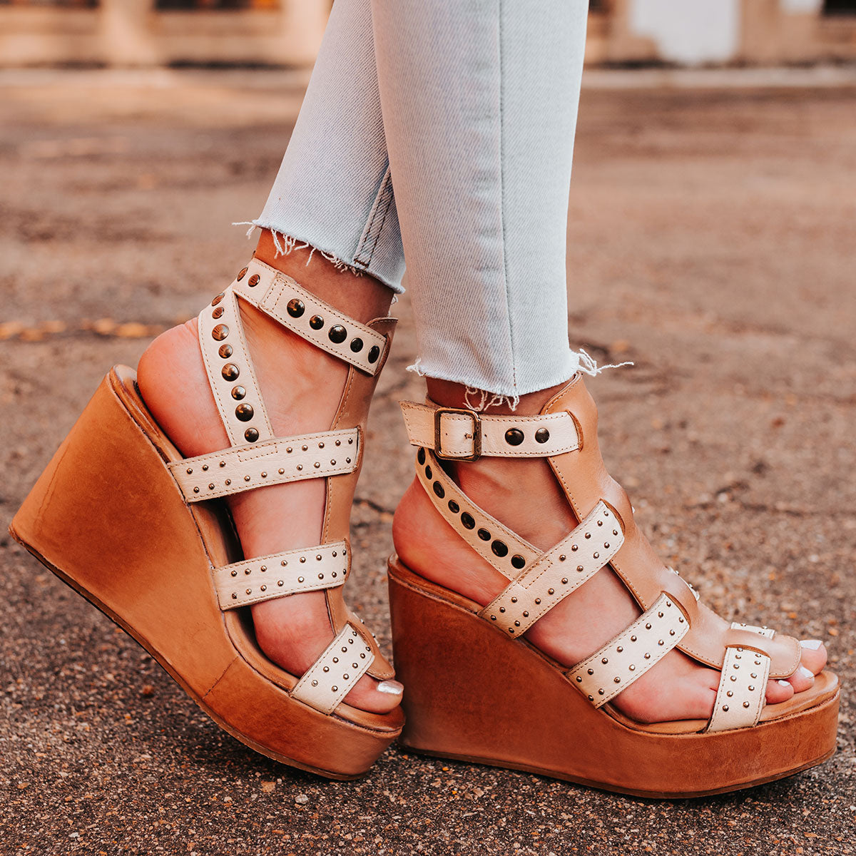 FREEBIRD women's Winter beige multi wedge heel platform sandal featuring an adjustable ankle strap and stud detailing