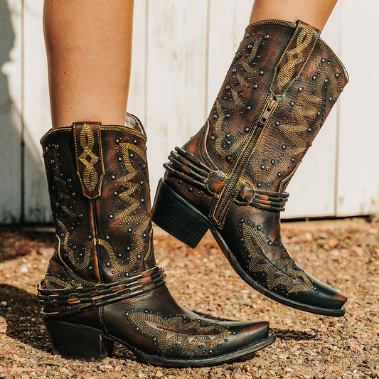 FREEBIRD women's Wisteria black boot with western stitching, silver stud detailing, and decorative ankle belting