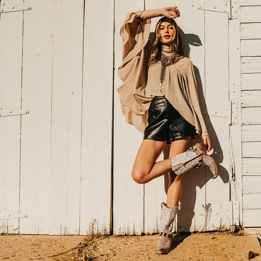 FREEBIRD women's Wisteria blush boot with western stitching, silver stud detailing, and decorative ankle belting lifestyle image