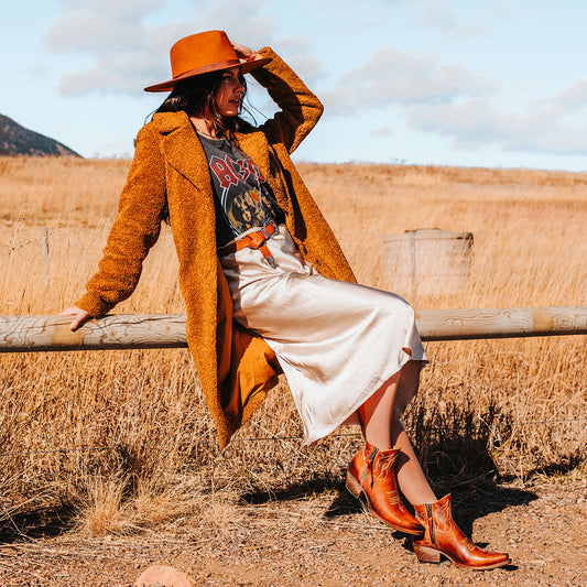 FREEBIRD women's Wolfie whiskey leather bootie with stitch detailing and snip toe construction lifestyle image