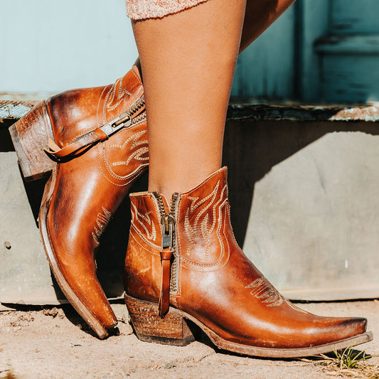 FREEBIRD women's Wolfie whiskey leather bootie with stitch detailing and snip toe construction