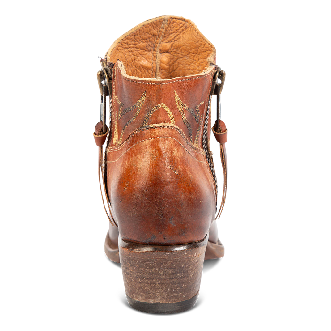 Back view of FREEBIRD women's Wolfie whiskey leather bootie with stitch detailing and low slanted heel