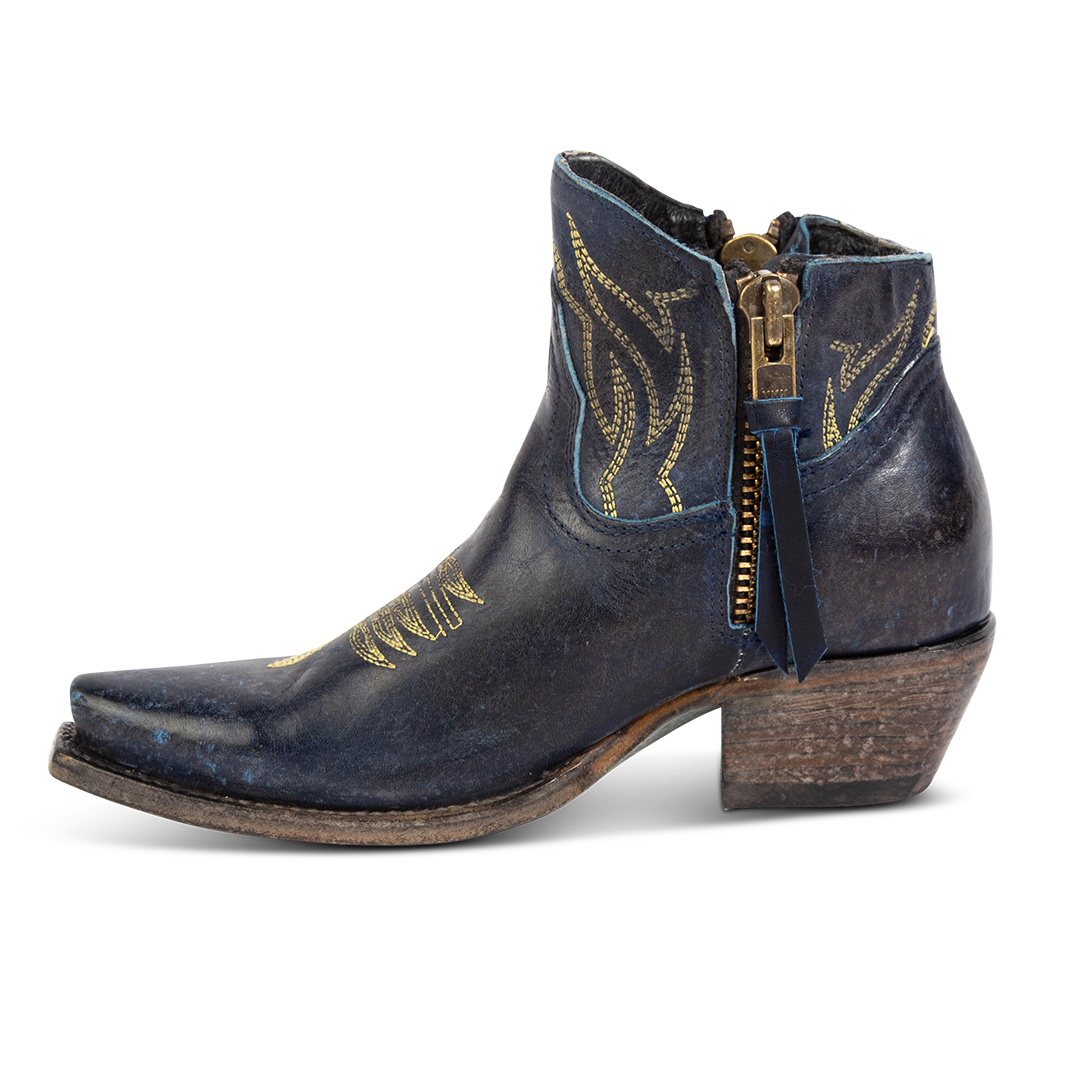 Side view of FREEBIRD women's Wolfie blue leather bootie with stitch detailing and snip toe construction