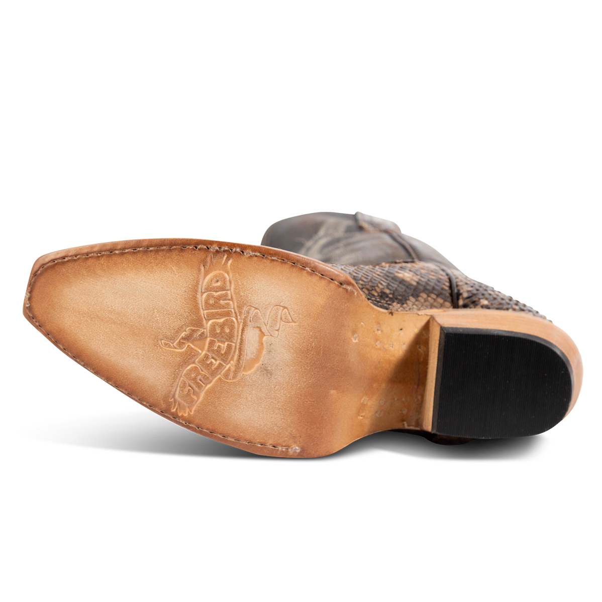 Leather sole imprinted with FREEBIRD on women's Woodland beige python multi leather boot