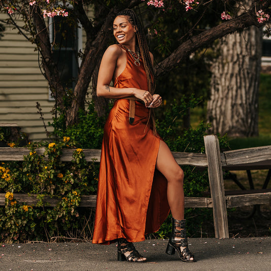 FREEBIRD women's Zeus Black a strappy heeled sandal featuring adjustable buckles, leather, and stud detailing lifestyle image