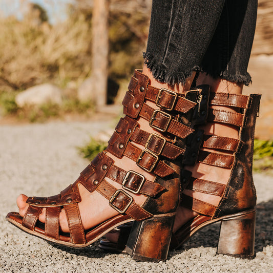 FREEBIRD women's Zeus Cognac Multi a strappy heeled sandal featuring adjustable buckles, leather, and stud detailing 