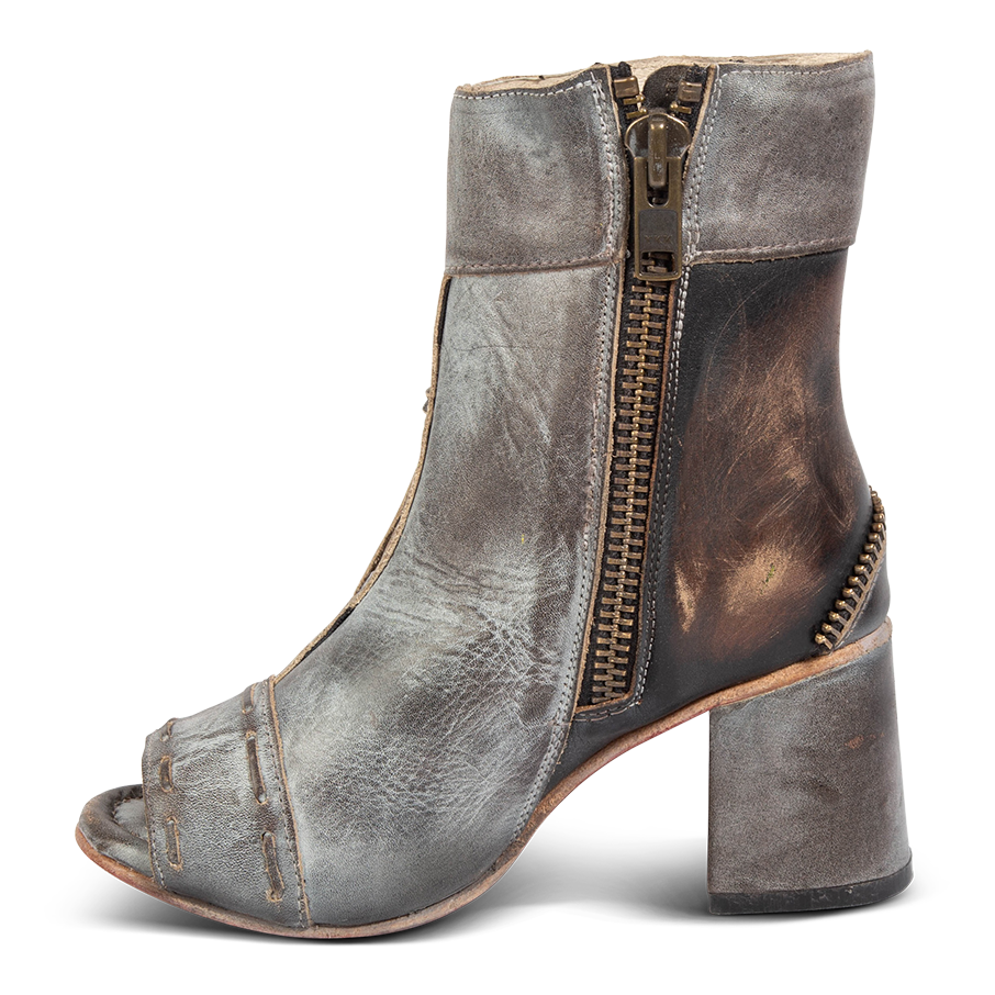 Inside view showing working brass zip closure and stacked heel on FREEBIRD women's Zombi ice sandal 