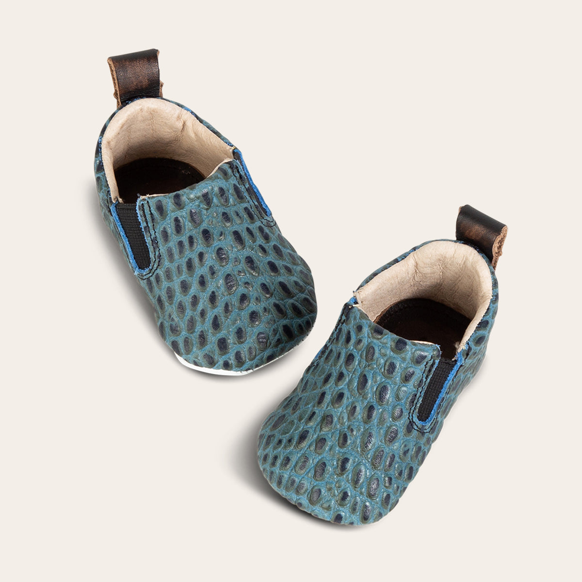FREEBIRD infant baby kicks turquoise croco leather shoe with pull tab and side elastic panel lifestyle image