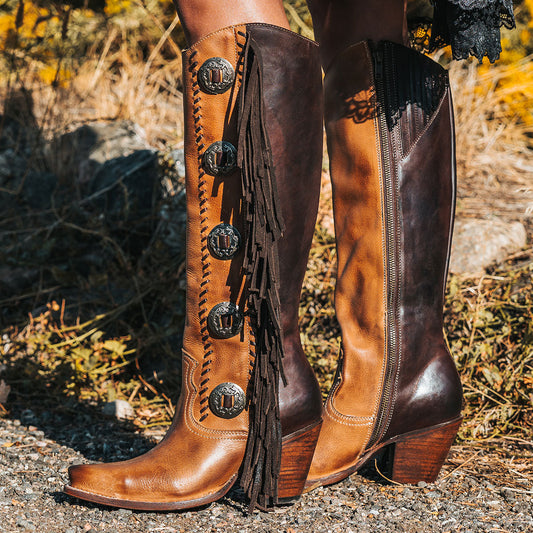 Freebird women's FARRAH tan multi leather knee-high boot with fringe detail, concho hardware and a tall heel 