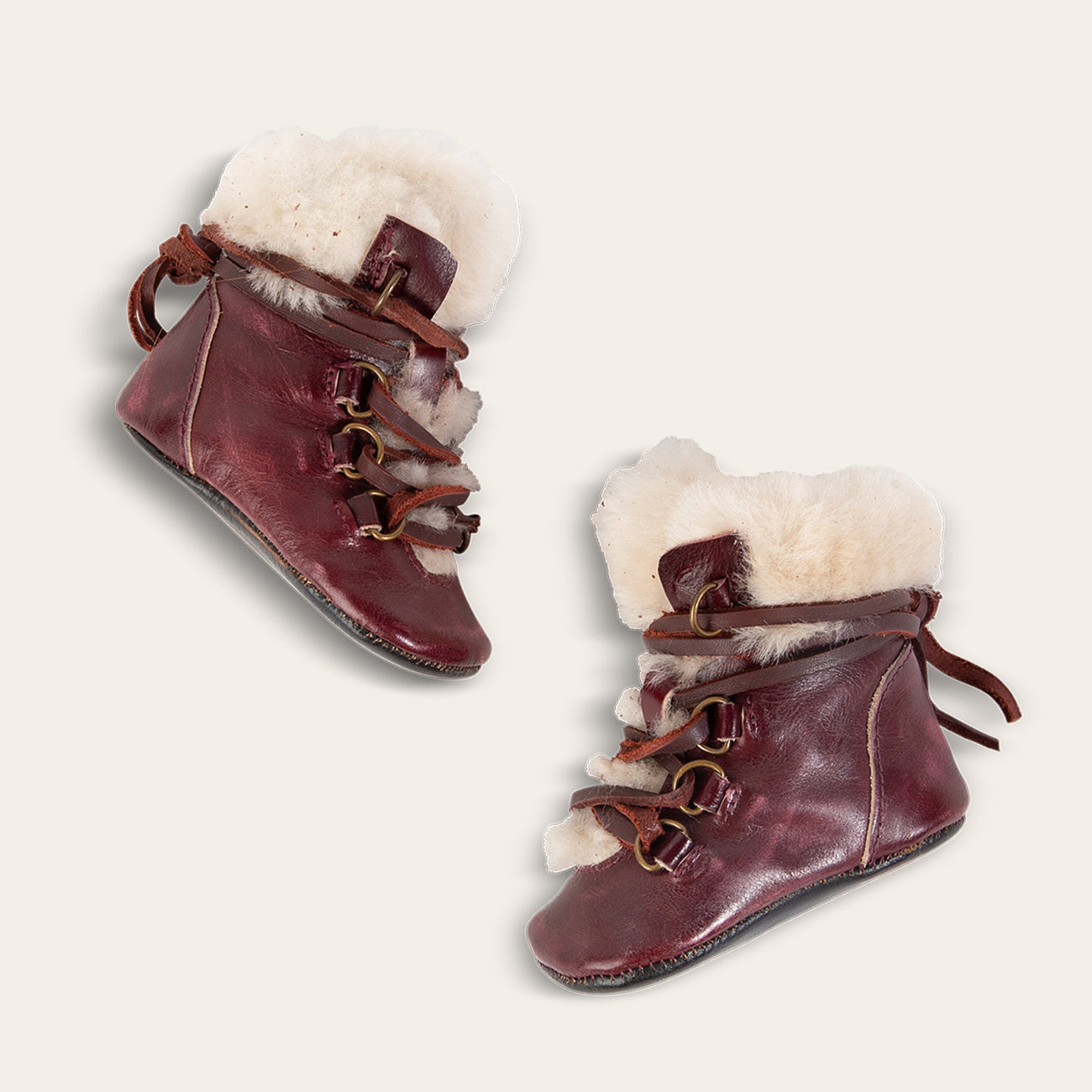 FREEBIRD infant baby Norway wine shearling lined leather bootie with front lacing lifestyle image