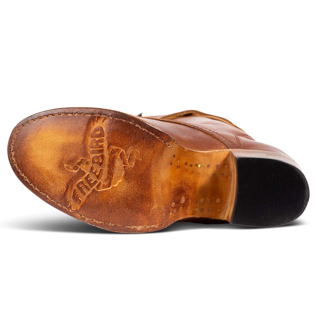 Tan leather sole imprinted with FREEBIRD on women's Grany cognac tall boot