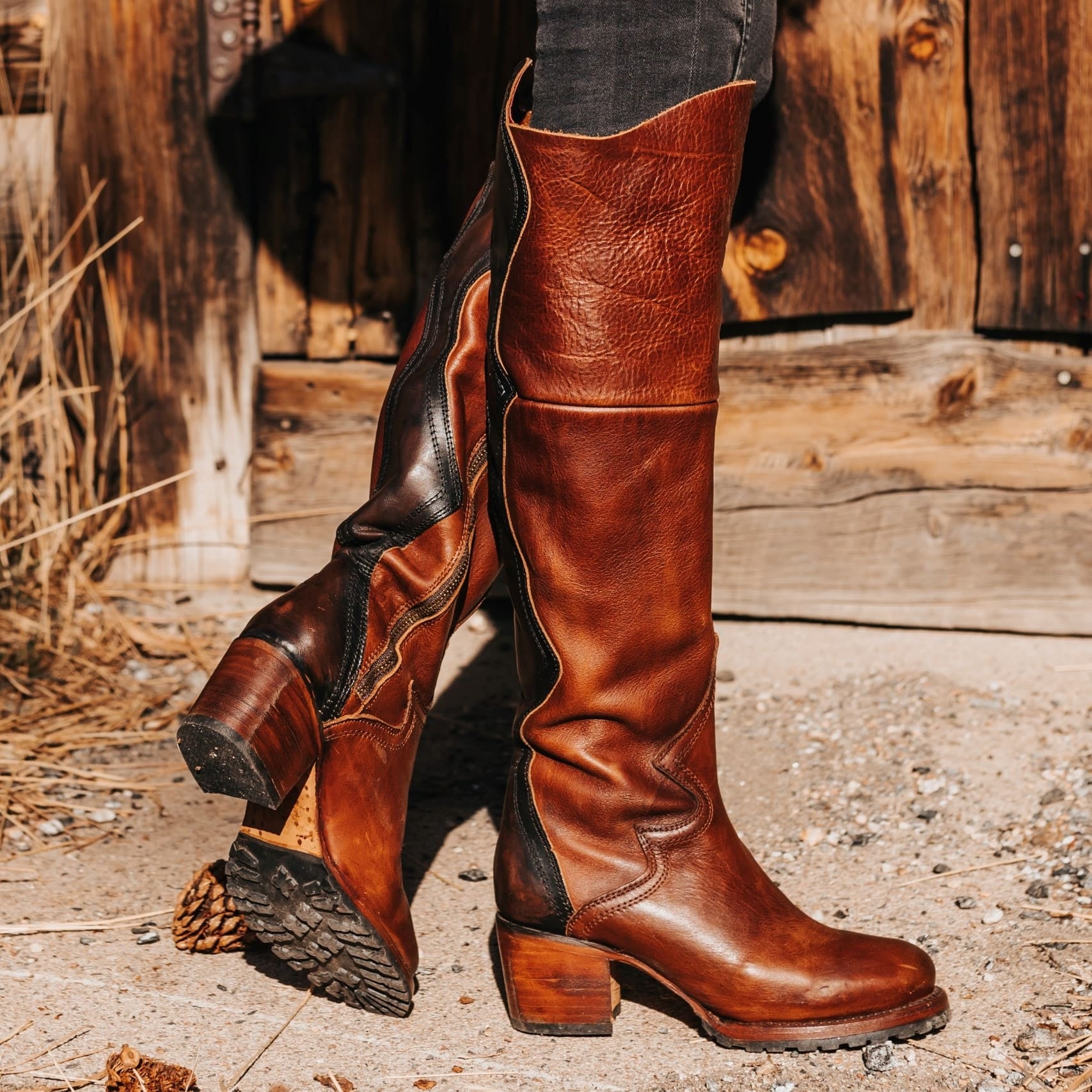 FREEBIRD women's Calgary cognac leather heeled knee high boot with contrasting back panel and rubber tread sole