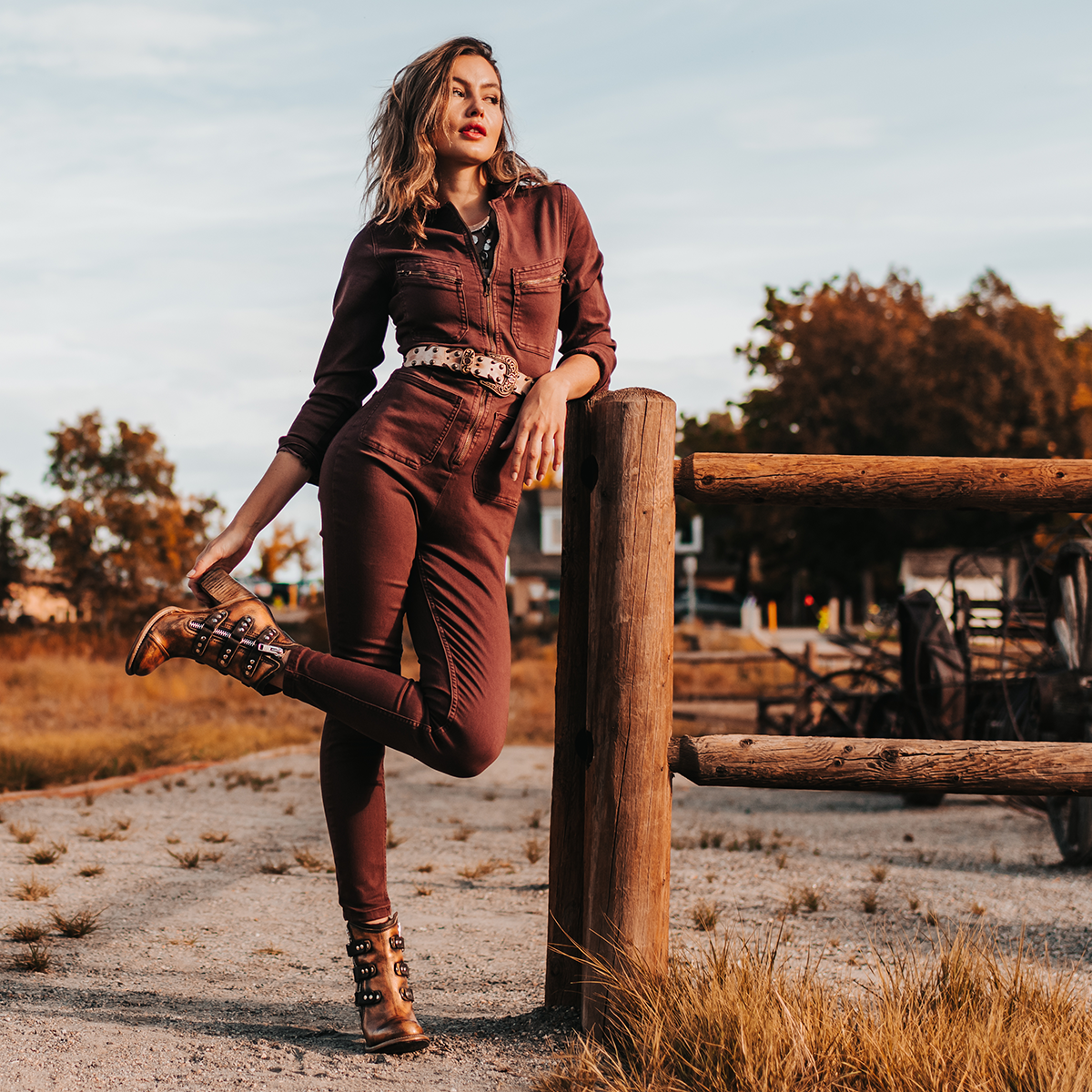 FREEBIRD women's Beckett bronze full grain leather bootie with inside zip closure, stacked heel, and embellished leather overlays lifestyle