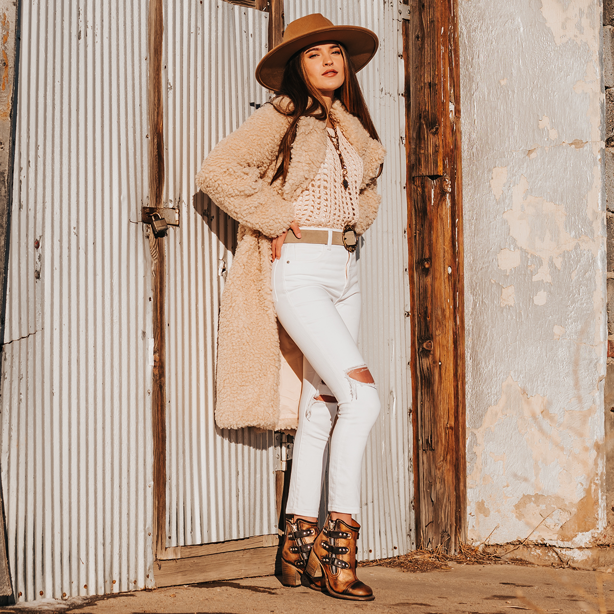 FREEBIRD women's Beckett bronze full grain leather bootie with inside zip closure, stacked heel, and embellished leather overlays lifestyle