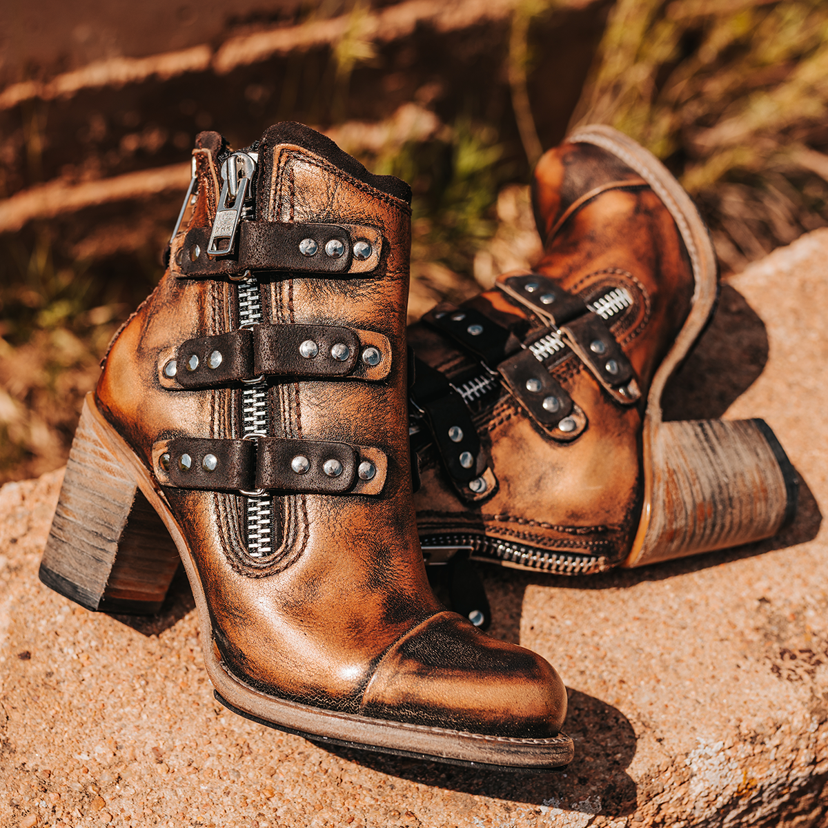 FREEBIRD women's Beckett bronze full grain leather bootie with inside zip closure, stacked heel, and embellished leather overlays