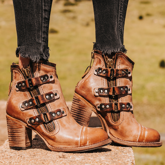 FREEBIRD women's Beckett taupe full grain leather bootie with inside zip closure, stacked heel, and embellished leather overlays