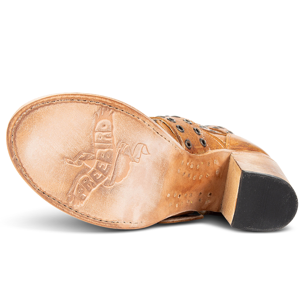 Leather sole imprinted with FREEBIRD on women's Blake wheat sandal