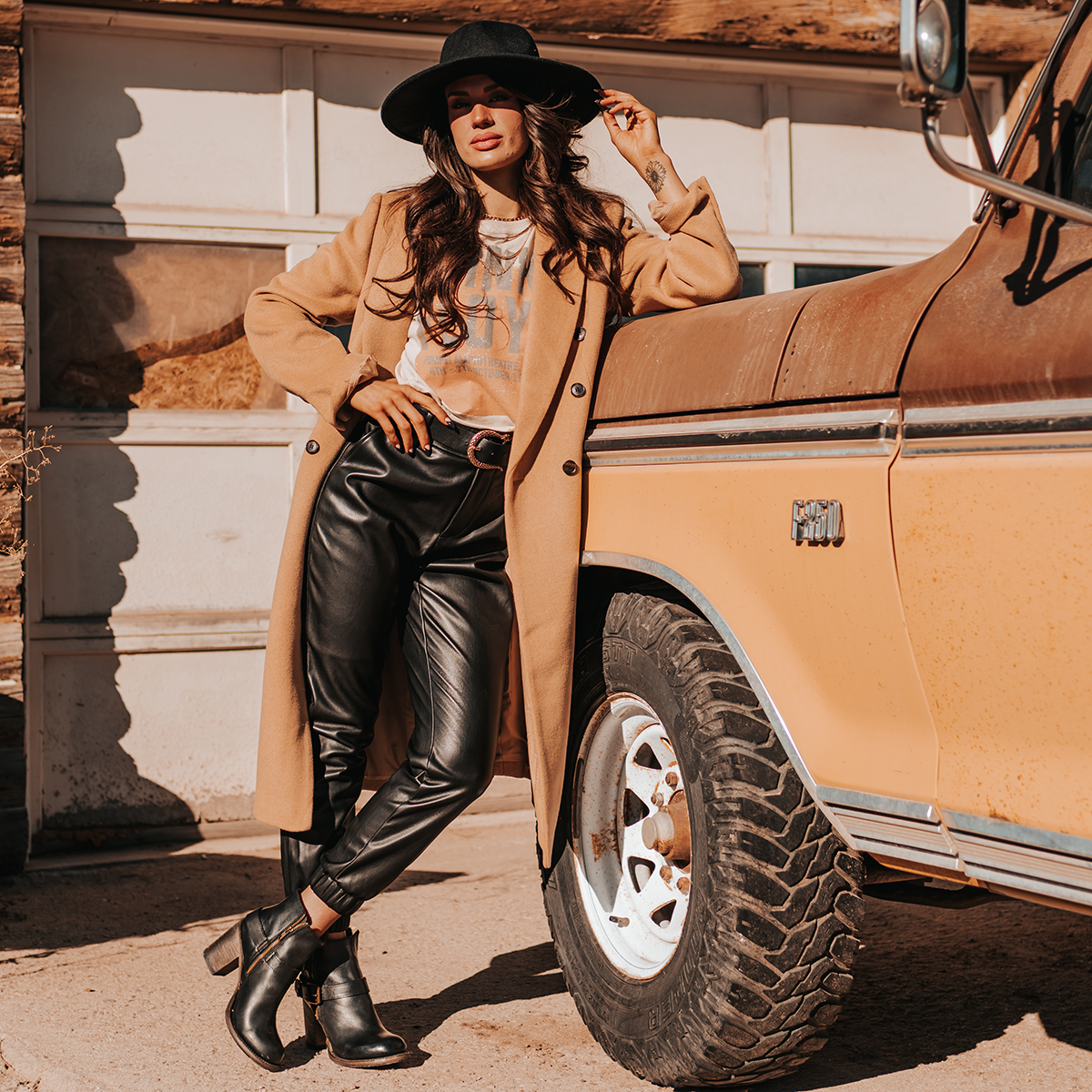 FREEBIRD women's Bolo black ankle bootie with double zip closures and fashion buckles with brass hardware lifestyle