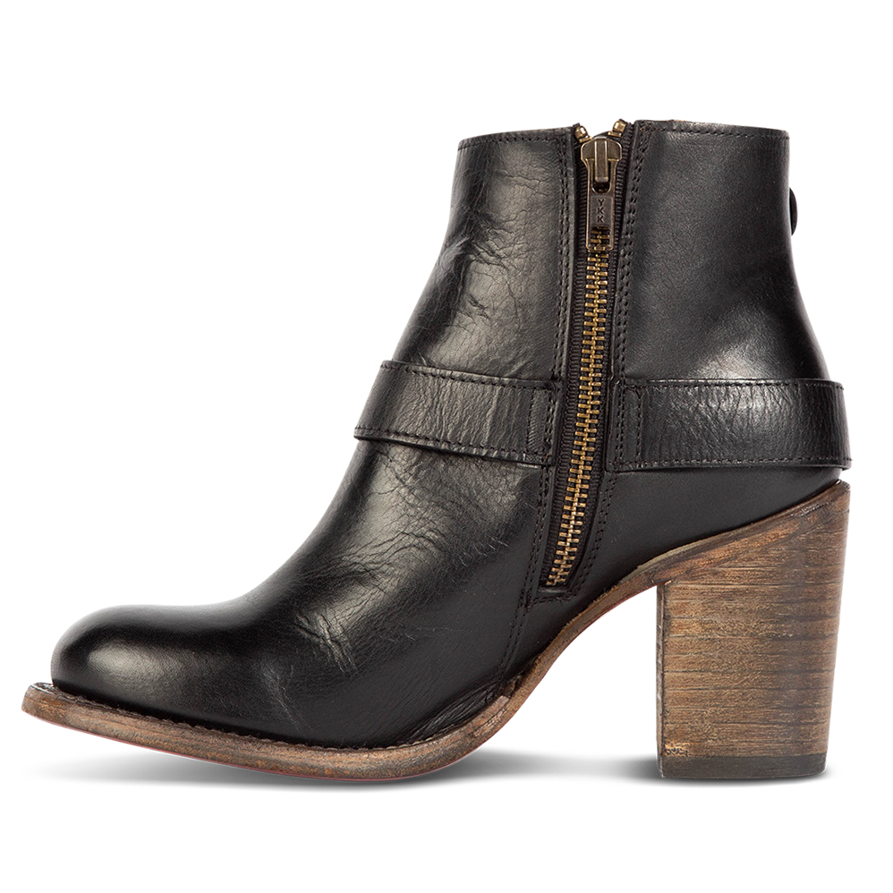 Inside view showing working brass zip closure and leather heel on FREEBIRD women's Bolo black ankle bootie