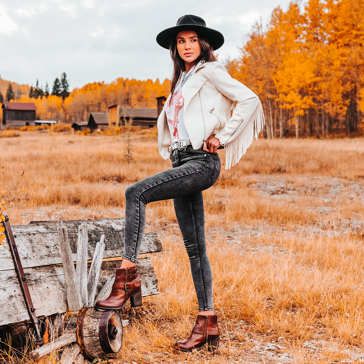 FREEBIRD women's Bolo cognac ankle bootie with double zip closures and fashion buckles with brass hardware lifestyle