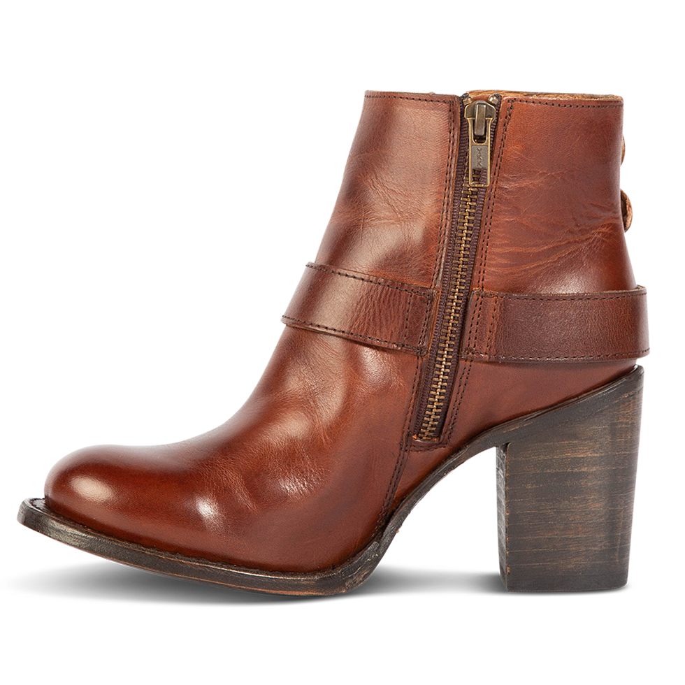 Inside view showing working brass zip closure and leather heel on FREEBIRD women's Bolo cognac ankle bootie