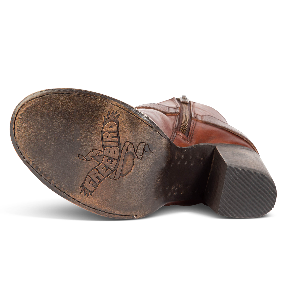 Black leather sole imprinted with FREEBIRD on women's Bolo cognac ankle bootie