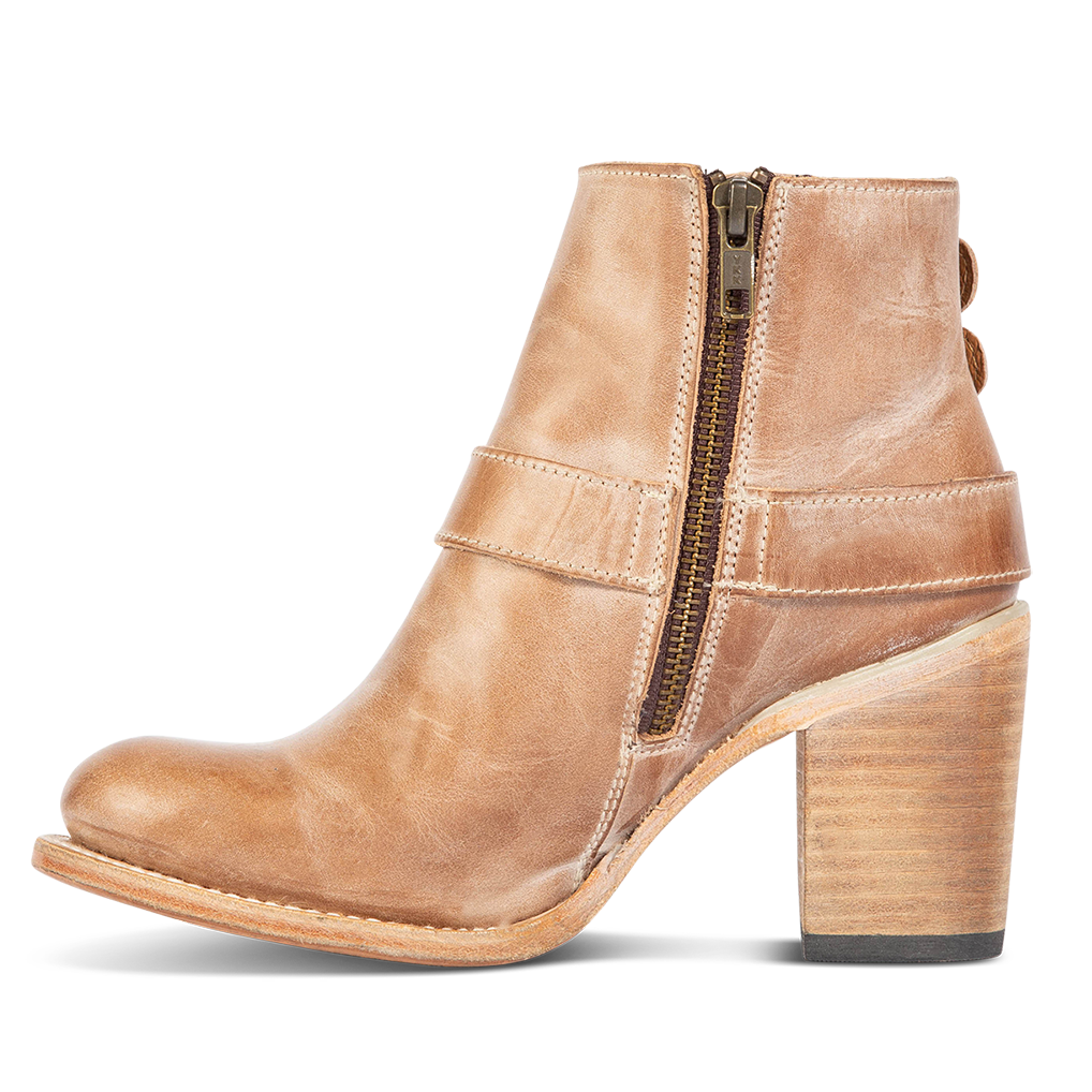 Inside view showing working brass zip closure and leather heel on FREEBIRD women's Bolo taupe ankle bootie