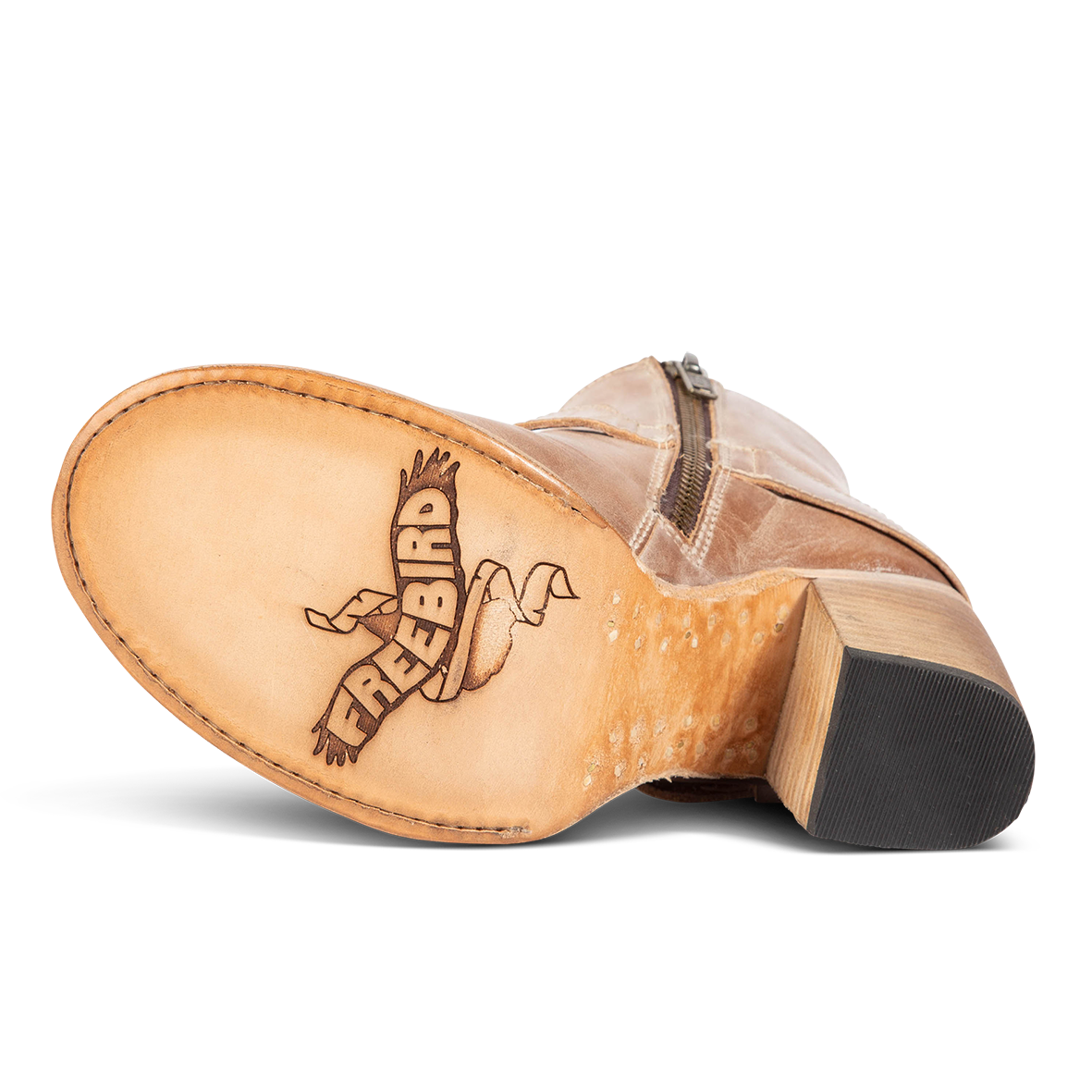 Red leather sole imprinted with FREEBIRD on women's Bolo taupe ankle bootie