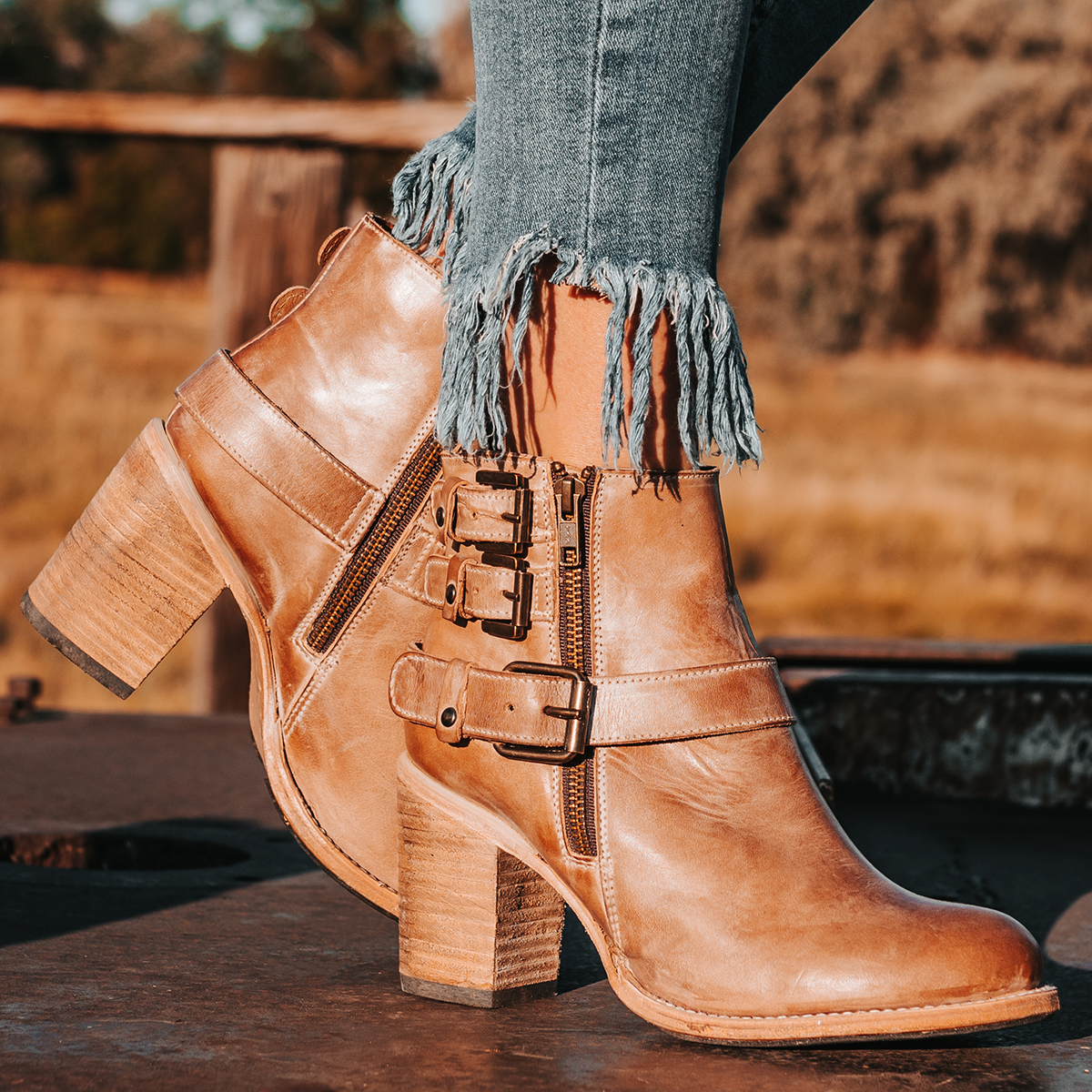 FREEBIRD women's Bolo taupe ankle bootie with double zip closures and fashion buckles with brass hardware