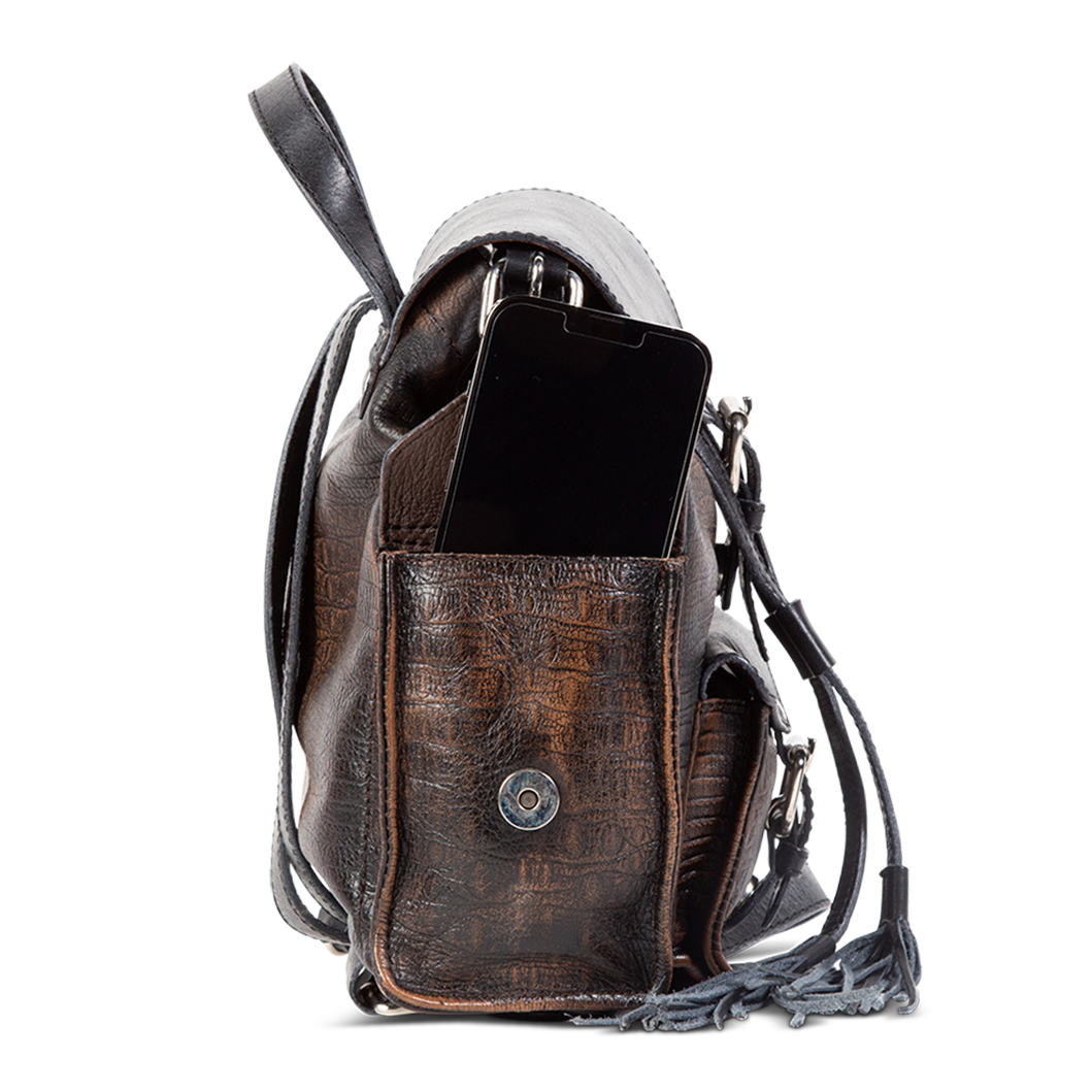 Brett black distressed exterior pockets with magnetic button clasp closures and decorative silver buckles 