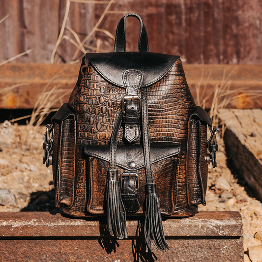 FREEBIRD Brett brown distressed embossed leather backpack with working exterior pockets and drawstring closure